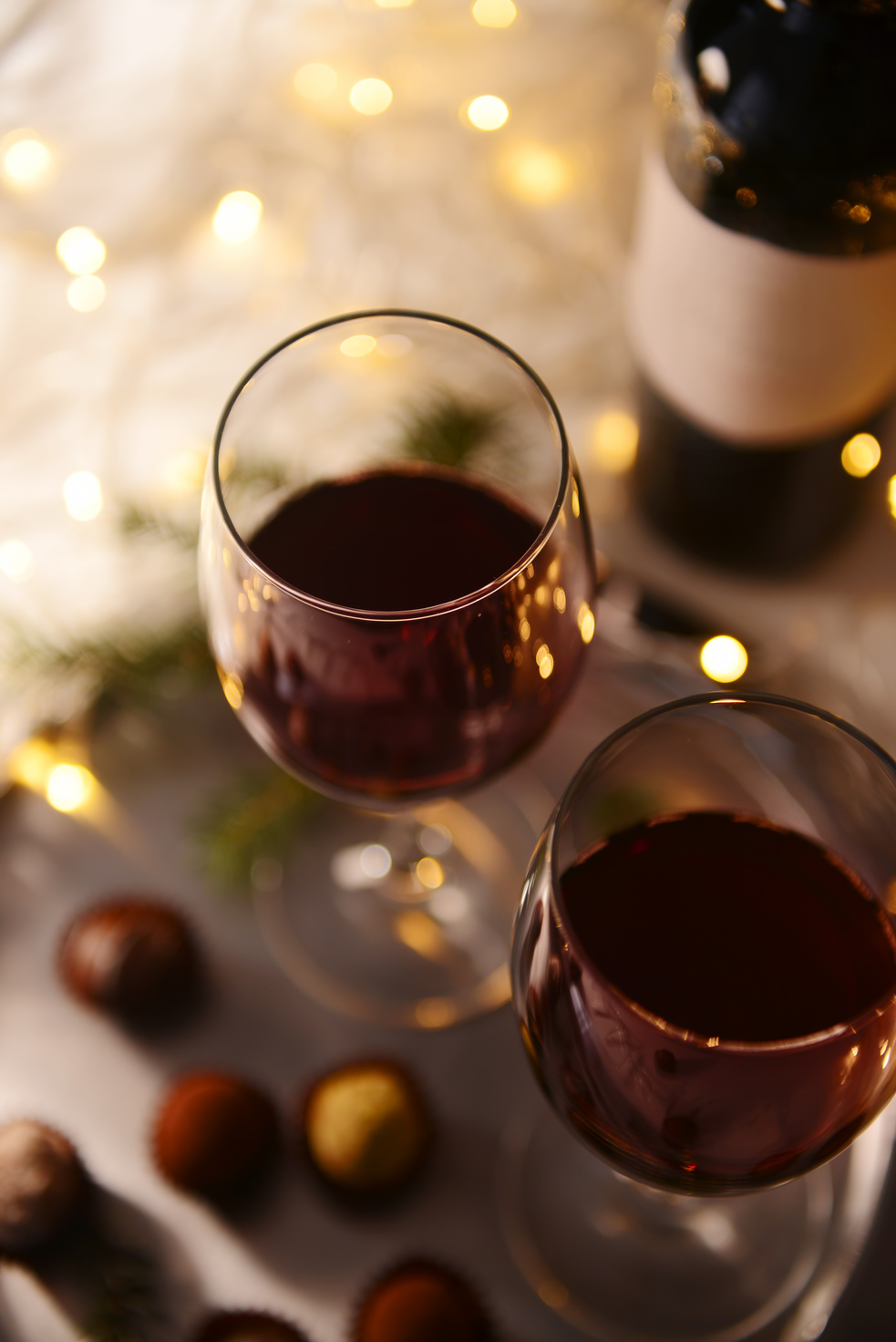 Glasses of Red Wine and Chocolate Truffles